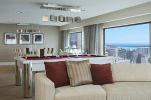 a living room with a couch and a pool table at Chicago Marriott Downtown Magnificent Mile in Chicago