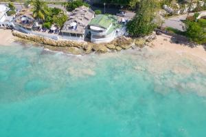 an aerial view of a house on a beach at Easy Reach villa in Saint Peter