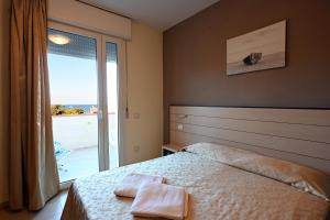 Postel nebo postele na pokoji v ubytování Hotel Paradiso Verde