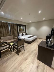 Voodi või voodid majutusasutuse Hotel Virgo Sumeru toas