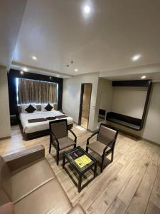 Voodi või voodid majutusasutuse Hotel Virgo Sumeru toas