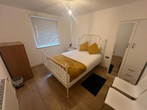 Een bed of bedden in een kamer bij The O2 Arena ExCel Canary Wharf London