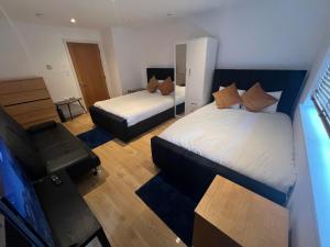Een bed of bedden in een kamer bij The O2 Arena ExCel Canary Wharf London