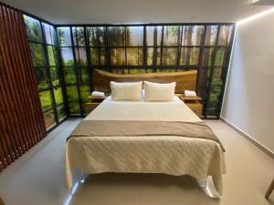Postel nebo postele na pokoji v ubytování Maidy Luxury Hotel