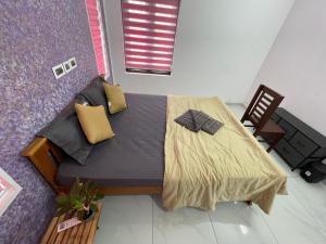 Postel nebo postele na pokoji v ubytování Varkala Life Homestay