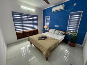 Postel nebo postele na pokoji v ubytování Varkala Life Homestay