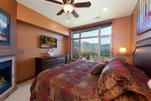 a bedroom with a bed and a fireplace at Peregrine Point 302 in Durango Mountain Resort +21 photos
