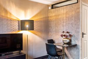 a dining room with a table and chairs at Loft 29 in Zandvoort