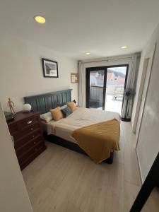 A bed or beds in a room at Sea View Penthouse with Large Terrace