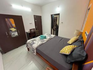 Postel nebo postele na pokoji v ubytování Varkala Life Homestay