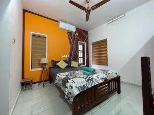 Postel nebo postele na pokoji v ubytování Varkala Life Homestay