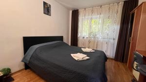 Ένα ή περισσότερα κρεβάτια σε δωμάτιο στο Cozy flat near the city center