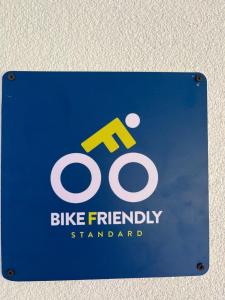 a blue sign with a bike friendly symbol on it at Kitka Hostel - Guest House in Tetovo +28 photos
