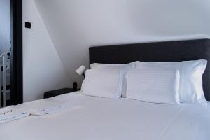 Postel nebo postele na pokoji v ubytování Kremna Concept