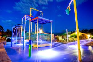 a playground at night with lights on it at Discovery Parks - Dubbo in Dubbo