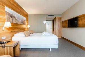Postelja oz. postelje v sobi nastanitve Suite with stunning sea view