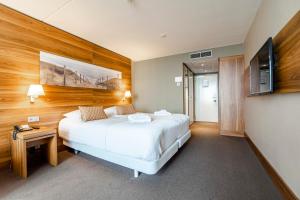 Postelja oz. postelje v sobi nastanitve Suite with stunning sea view