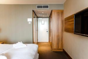 Postelja oz. postelje v sobi nastanitve Suite with stunning sea view