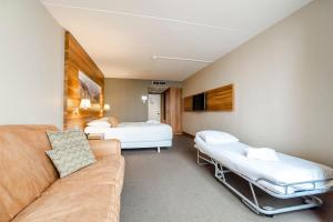 Postelja oz. postelje v sobi nastanitve Suite with stunning sea view