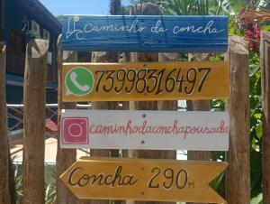 een bord bij de ingang van het resort bij Pousada Caminho da Concha in Itacaré