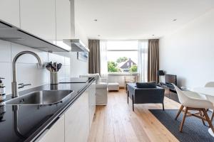 Кухня или мини-кухня в The apartment Shell 42
