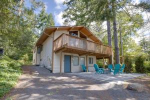a house with a deck and chairs in front of it at The Three Bears MCA 901 - Meredith Lodging in Manzanita