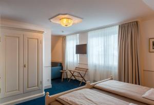 Postel nebo postele na pokoji v ubytování Hotel Appenzell