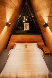 Postel nebo postele na pokoji v ubytování Cabaña Raices Habitat