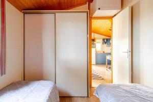 Posteľ alebo postele v izbe v ubytovaní Chalet Mer et Pins