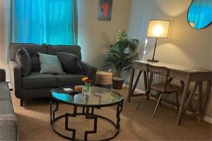 a living room with a couch and a table at Apt 3 Comfortable and Convenient in Masury