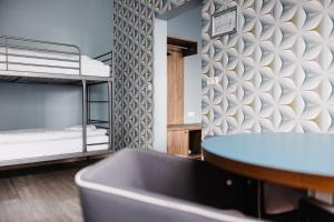 Letto o letti in una camera di ODDSSON Midtown Hotel