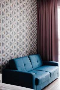 Area soggiorno di ODDSSON Midtown Hotel
