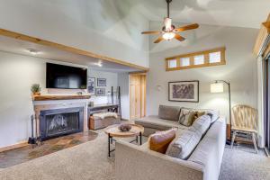 a living room with a couch and a fireplace at Ski Shuttle and Mountain Views Keystone Resort Home in Keystone
