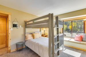 a bedroom with a bunk bed and a window at Ski Shuttle and Mountain Views Keystone Resort Home in Keystone +24 photos