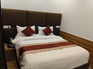 Postel nebo postele na pokoji v ubytování Hotel Obsidian Red