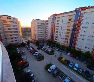 an aerial view of a parking lot with parked cars at Prishtina Host in Prishtinë