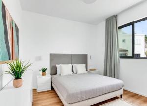 Postel nebo postele na pokoji v ubytování Olive Shared Pool Apartments + 24 fotografií
