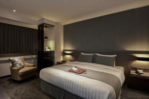 Postel nebo postele na pokoji v ubytování Wonstar Hotel