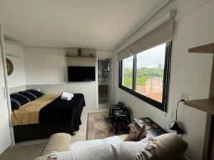 Postel nebo postele na pokoji v ubytování The Park- no coração de POA + 14 fotografií