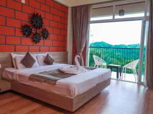 Krevet ili kreveti u jedinici u okviru objekta Serene Crest Resort