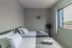 Ένα ή περισσότερα κρεβάτια σε δωμάτιο στο Duplex 2Q próx. praia c/ garagem RRT0098