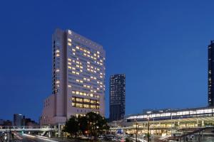 a tall building in a city at night at Sheraton Grand Hiroshima Hotel in Hiroshima