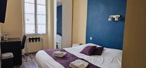 Llit o llits en una habitació de Hotel Belvue