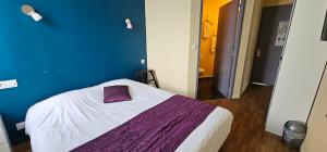Llit o llits en una habitació de Hotel Belvue