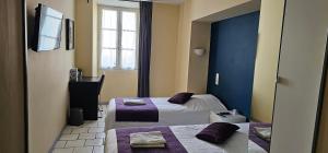 Postel nebo postele na pokoji v ubytování Hotel Belvue