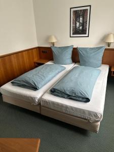 Voodi või voodid majutusasutuse Hotel Graßer toas