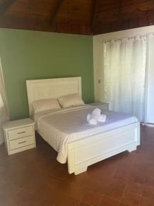 Postel nebo postele na pokoji v ubytování Palms Lounge Cabarete