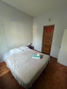 a bedroom with a bed with a tray on it at Hotel Nativo in Santiago