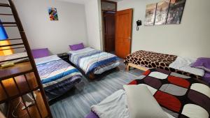 Postel nebo postele na pokoji v ubytování TRANSFER VIP HOSTEL
