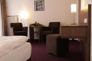 Postel nebo postele na pokoji v ubytování Hotel Buntrock